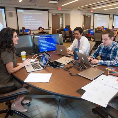 employees working collaboratively around a conference table