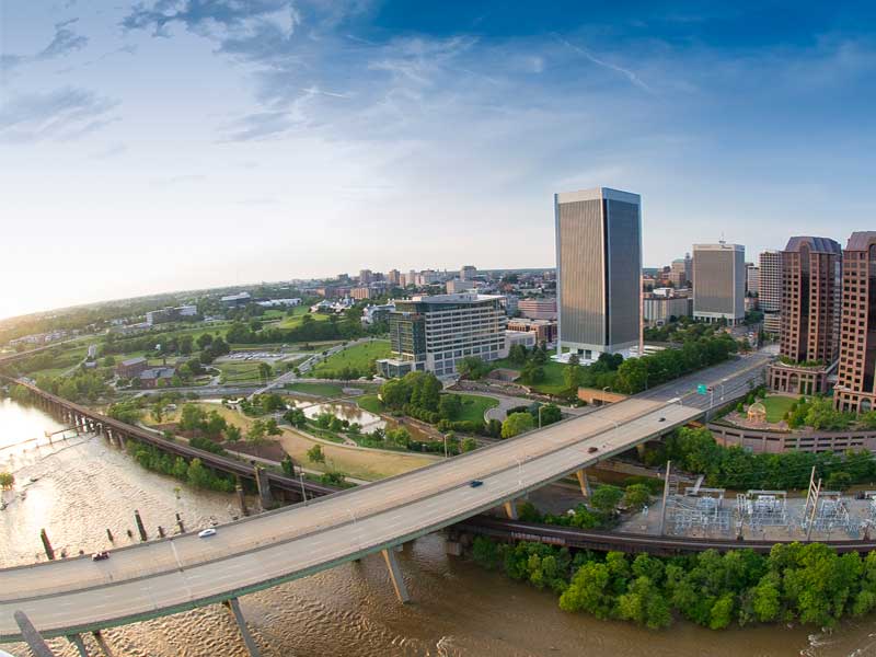 aerial view of the james river, a bridge, and downtown richmond virginia