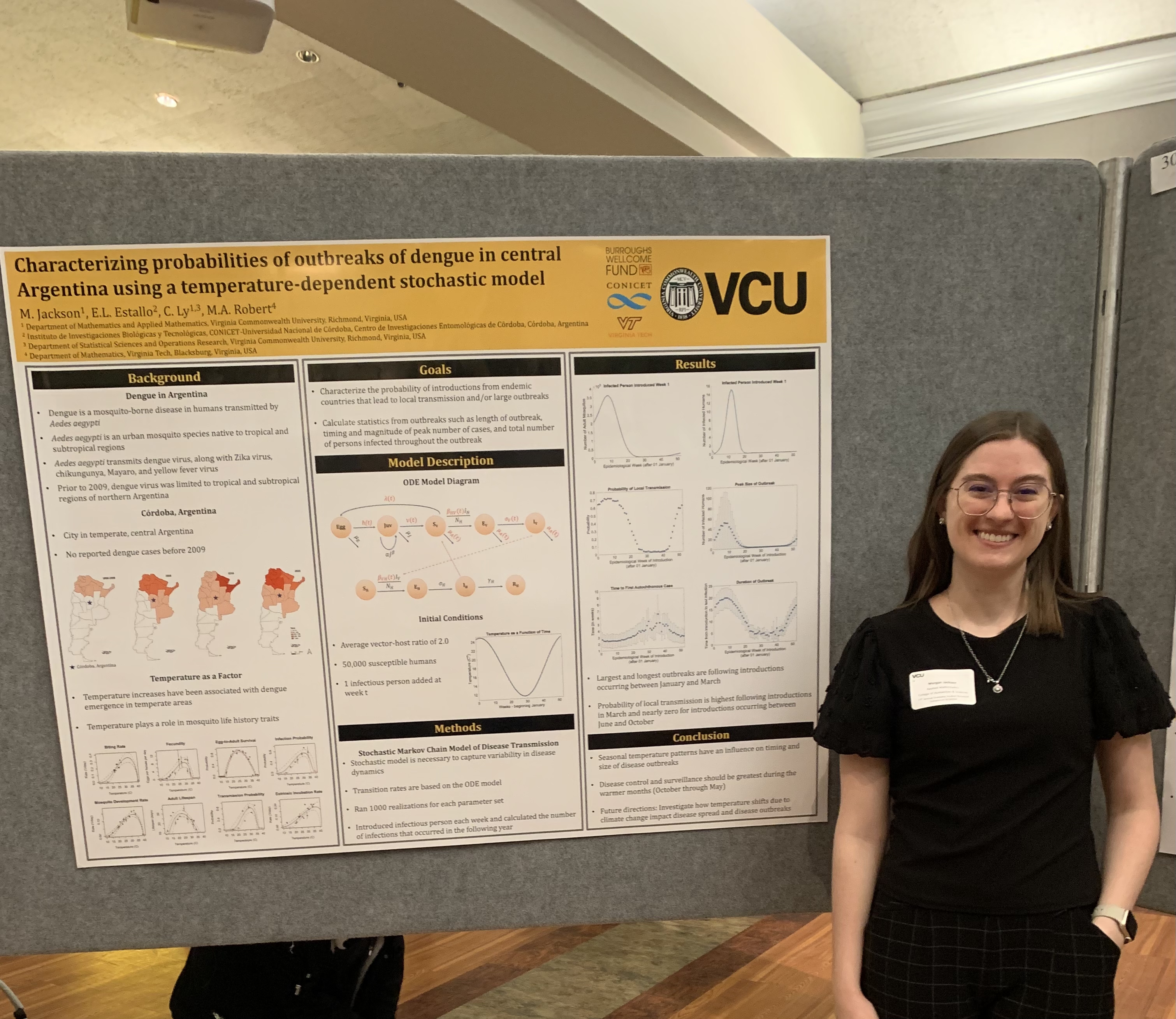 Morgan Hold Jackson stands beside a research poster